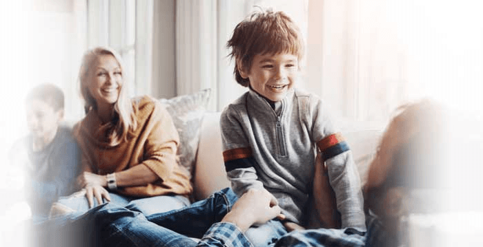 A happy family relaxing comfortably at home